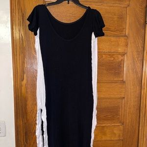 Stretchy black dress with slits on both sides.